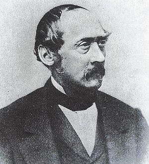 Schwarz-weiß-Porträt eines Mannes aus dem 19. Jahrhundert.